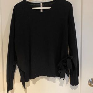 Women’s sweater with side ties.